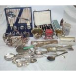 A crate containing a quantity of silver plated items including cased and loose cutlery, stand, etc.