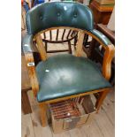 A bow elbow chair with studded green leather upholstered back and seat, set on square supports -