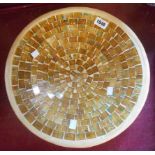 A large terracotta dish with inset glass mosaic tiled pattern