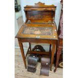 A 53cm Edwardian inlaid rosewood writing desk with raised back, flanking inkwells and remains of