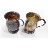 Two silver mugs, both with scroll handles and engraved initials