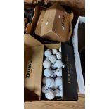 Four boxes containing a quantity of assorted golf balls