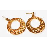 A pair of yellow metal ornate pierced disc earrings