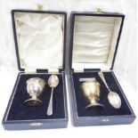 A cased silver egg cup and spoon set - Birmingham 1969 - sold with another similar (napkin ring
