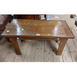 A 79.5cm stained oak coffee table, set on fluted legs