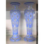 A pair of 19th Century Bohemian blue flash cut overlay glass vases with all-over window cut