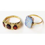A marked 10k doublet opal panel ring - sold with a silver gilt three stone garnet ring - sizes O and
