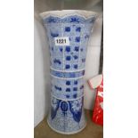 An antique Chinese porcelain vase of waisted cylindrical form with all-over hand painted blue