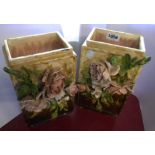 A pair of majolica pottery vases with applied floral sprays and coloured lead glaze decoration -