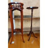 A reproduction mahogany jardiniere stand with spindle gallery to top and circular undertier, set