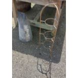 A vintage metal three tier plant stand and a coal scuttle