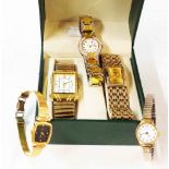 A box containing four ladies' wristwatches and another, all with quartz movements