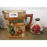 A Doulton Dickensware Oliver Twist jug with moulded decoration - sold with a Cobridgeware pottery