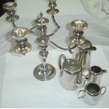 A silver plated four piece tea set - sold with a plated four branch five light candelabrum
