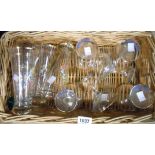 A basket containing a set of six vintage Babycham glasses, similar Britvic advertising glasses,