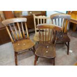 A pair of old lathe back kitchen chairs with moulded solid elm seats - sold with a stick back