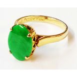 A Bella marked 14k yellow metal ring, set with flat oval jade panel - size M 1/2