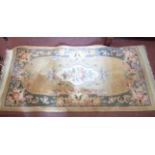 A Chinese washed wool rug with floral decoration on old gold ground - 1.6m X 78cm