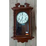 A boxed modern Hermle polished wood cased regulator style wall clock with eight day chiming