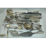 A crate containing a quantity of silver plated serving and other cutlery including a large