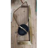 A brass coal bucket - sold with a brass fire fender and mesh fire guard - various condition