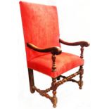 An antique walnut framed open armchair of 17th Century design with old rose velour upholstered