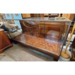 A 1.83m vintage commercial shop display cabinet with brass beaded glazing enclosing glass shelves