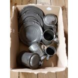A box containing a quantity of antique and later pewter including lidded tankards, plates with