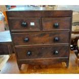A 39.5cm 19th Century mahogany miniature chest of two short and two long graduated drawers, set on