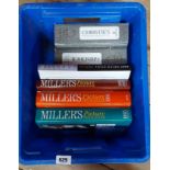 A crate containing a quantity of Millers and other picture price guides
