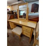 A 1.26m modern golden oak kneehole dressing table with swing mirror and four flanking drawers - sold