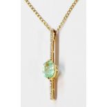 A 750 (18ct.) gold bar pendant, set with oval aquamarine and row of tiny diamonds, on 375 gold