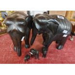 Two large carved ebony elephants - sold with three smaller similar - various condition