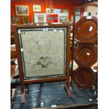 An oak framed firescreen with antique Chinese embroidered silk panel under glass - sold with a