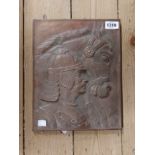 An embossed copper plaque depicting a warrior and his horse