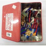 A tin containing seventeen (mainly replica) medals with ribbons