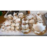 A large quantity of Royal Albert bone china tea and dinner ware decorated in the Old Country Roses