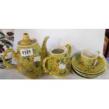 A 20th Century Chinese porcelain part tea set with enamelled decoration on a yellow ground