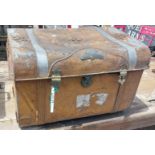 A vintage metal travelling trunk containing a selection of items including decorative metal box,