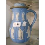 A 19th Century Wedgwood blue jasper dip jug with moulded arch decoration, jasper sprigging depicting