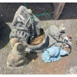 A cast concrete water mill pattern garden ornament - sold with six other garden ornaments