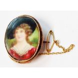 A 1916 9ct. gold mounted porcelain portrait panel brooch with safety chain - puce ink inscription