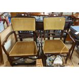 A pair of late Victorian mahogany framed panel back elbow chairs with old gold velour upholstery and