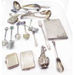 Two silver vesta cases, one with inscription, a white metal scent bottle and a white metal scoop -