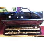 A Yamaha flute in original hard case and vinyl carry bag