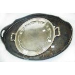 A 61.5cm old silver plated oval serving tray with flanking pierced handles - sold with a smaller