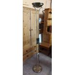 A modern antiqued brass effect uplighter standard lamp with poseable reading lamp and circular base