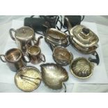 A box containing a quantity of silver plated items including two three piece tea sets, wine coaster,
