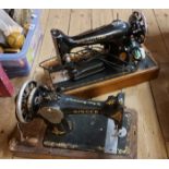 Two old Singer sewing machines