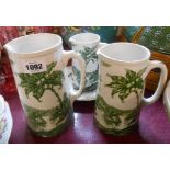 A set of three 19th Century graduated jugs decorated with a green transfer printed scene depicting